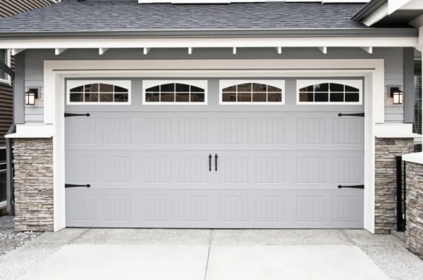 A white garage door with windows on the side.