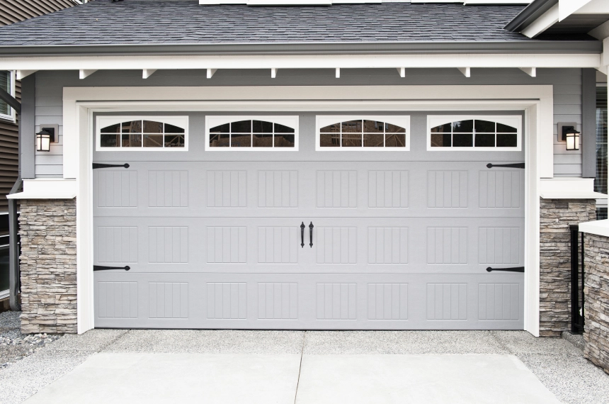 A white garage door with windows on the side.